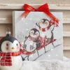 Sledding Penguins 6 Inch Tabletop LED Lighted Print On Canvas With Stand 1 Sledding Penguins 6 Inch Tabletop LED Lighted Print On Canvas With Stand -Solar Christmas Holiday Shop 4139424 lifestyle