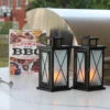 Set Of 2 LED Fire Flame Metal And Glass Lanterns 1 Set Of 2 LED Fire Flame Metal And Glass Lanterns -Solar Christmas Holiday Shop set of 2 fireglow lanterns